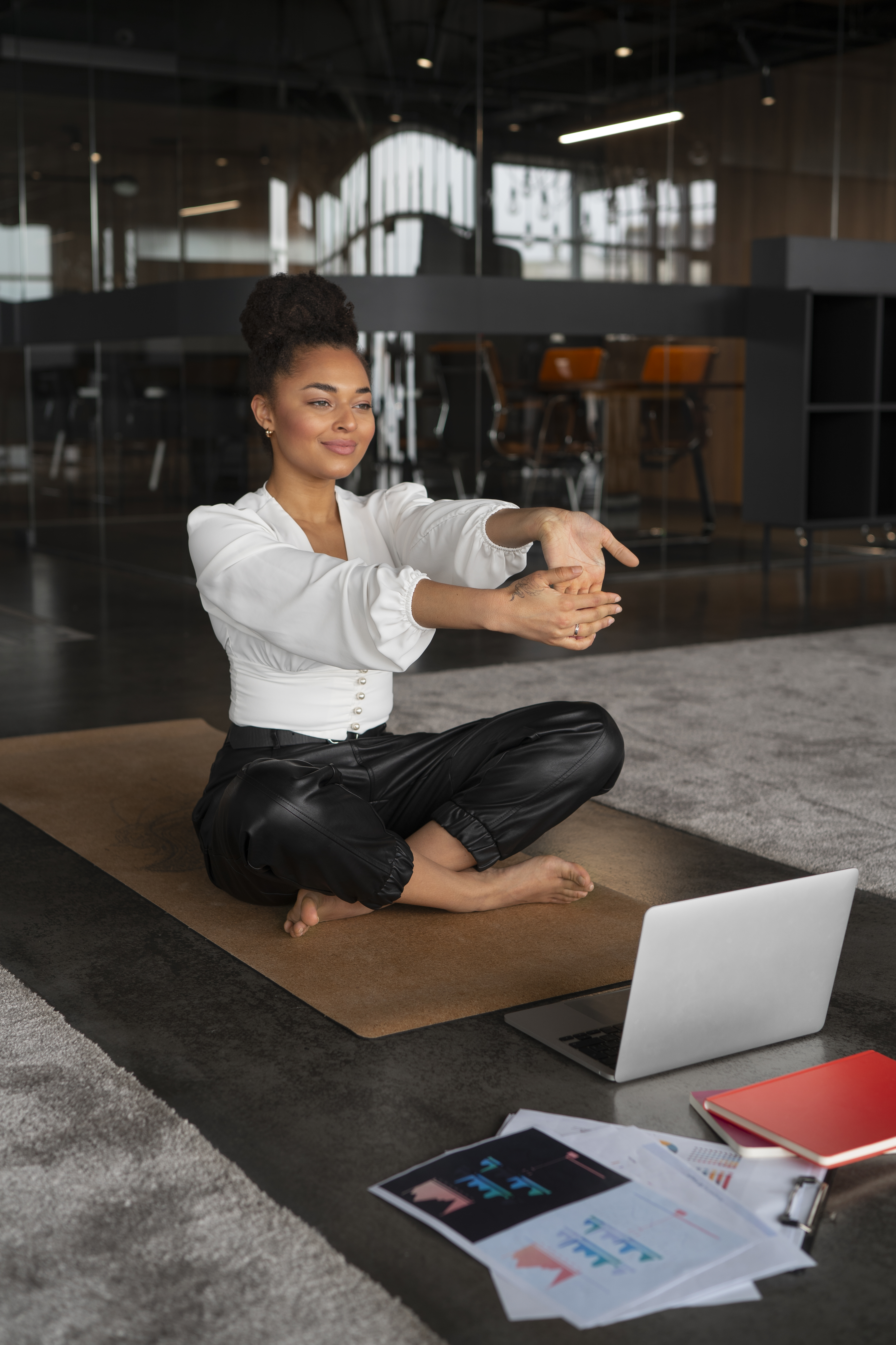 full-shot-woman-stretching-work full-shot-woman-stretching-work